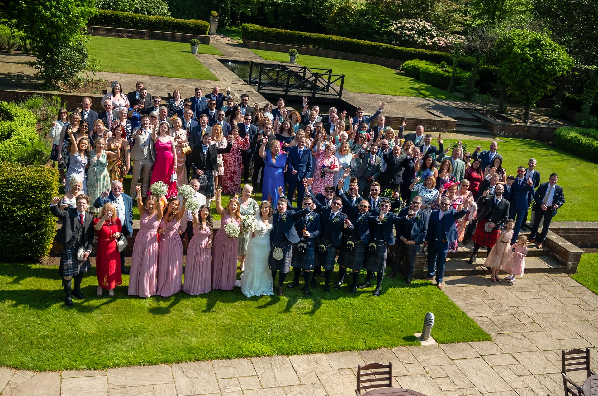 Guests toasting to the newly weds