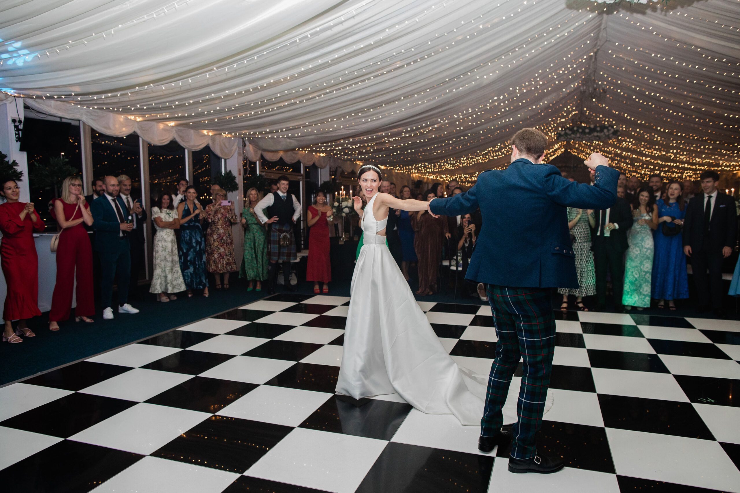 ride and groom sharing their first dance in the marquee at Ayrshire wedding venue Western House Hotel
