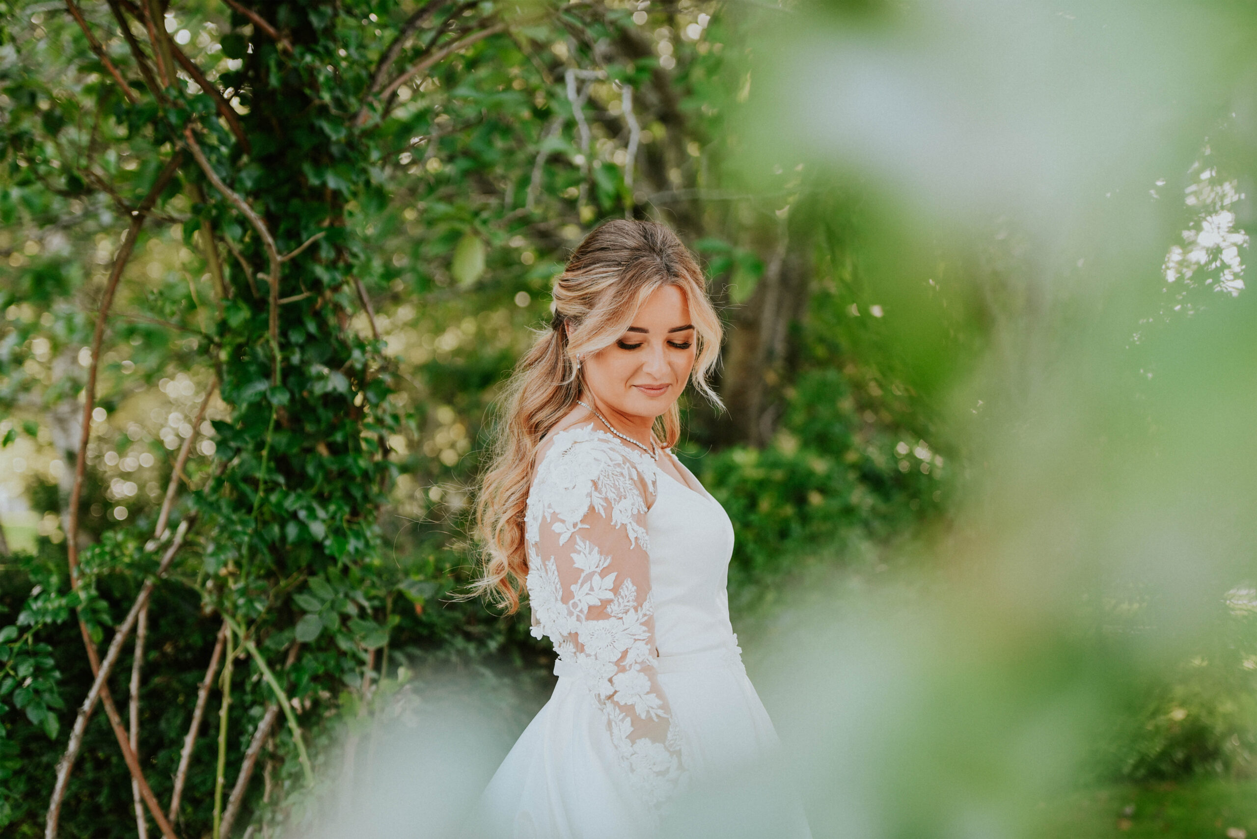 Beautiful bride posing in the gardens of Western House Hotel in Ayrshire