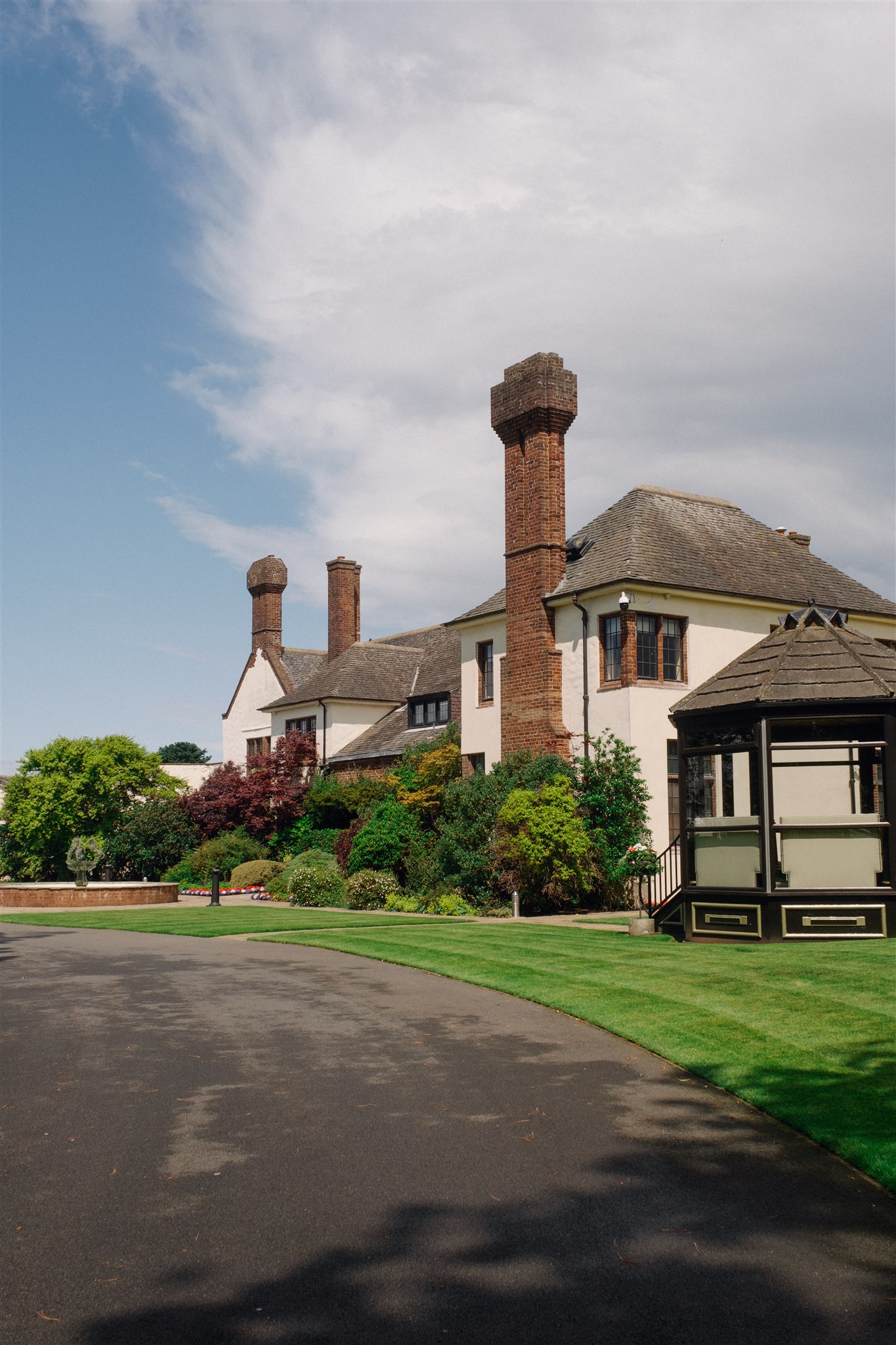 Outdoor shot of Western House Hotel with gardens and pathways